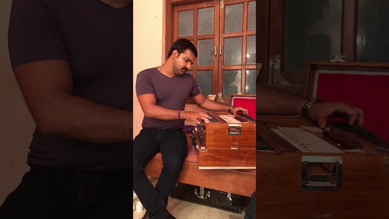 Pawan singh while playing harmonium