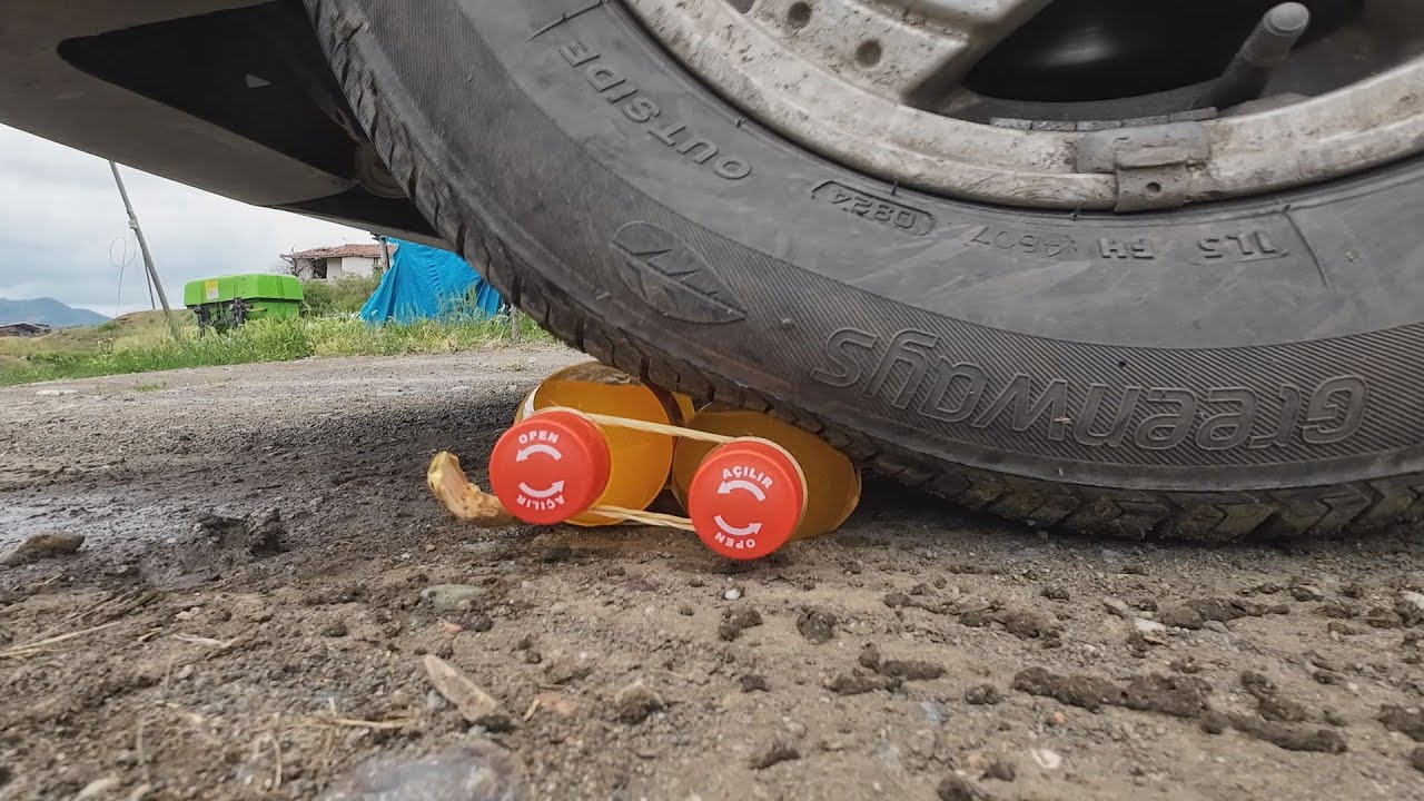 SMASHING SMALL COLA BOTTLES WITH A CAR TIRE