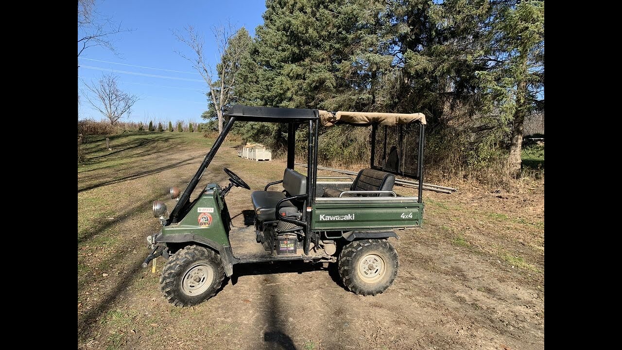 Unstraping the Mule 2510 and unloading it.