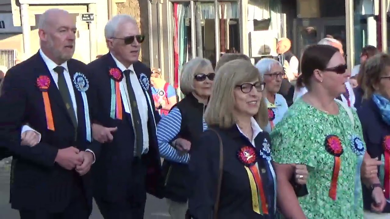 The clock strikes 6am and the procession moves off around the town