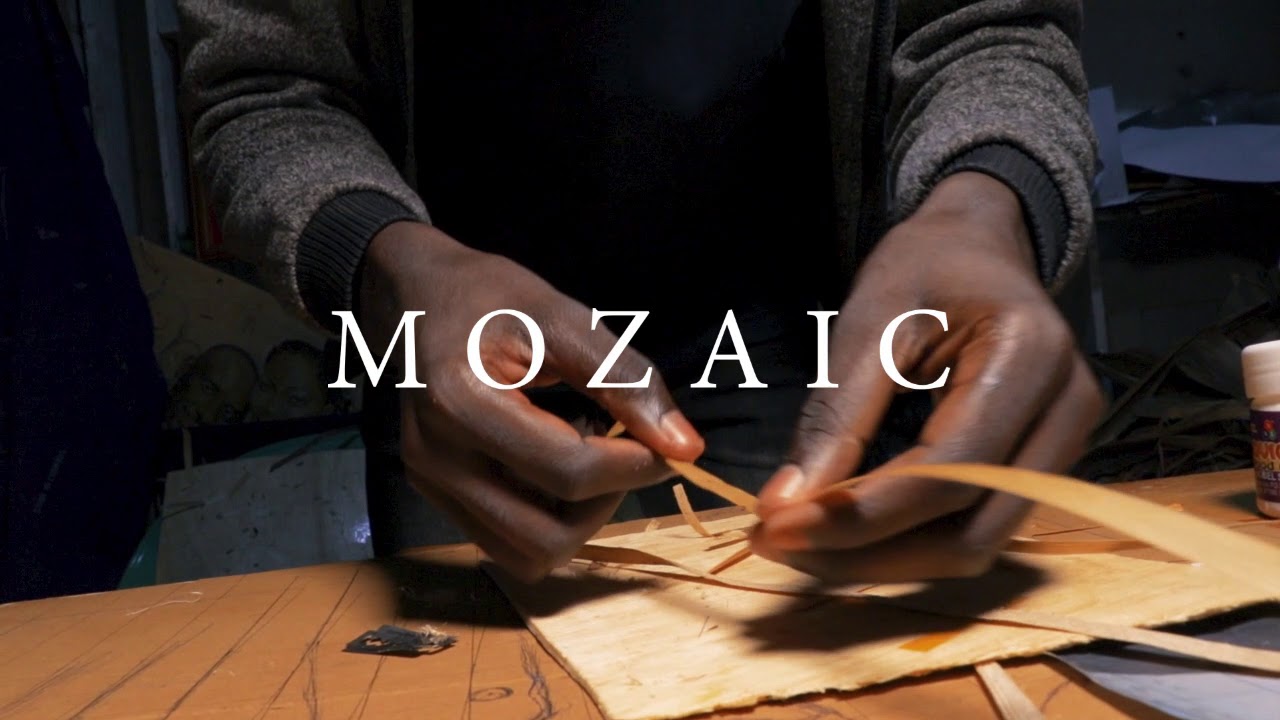 Ugandan Artist doing banana fibre mosaic Art