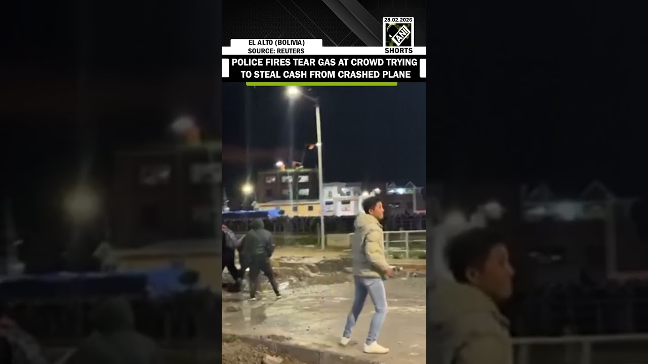 Bolivian police using tear gas to disperse crowds collecting cash from plane crash in El Alto