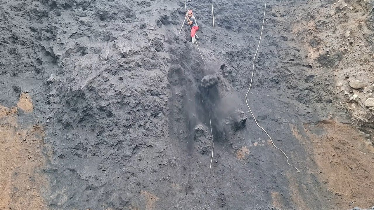 Sandman is back in action digging up the black sand cliffs