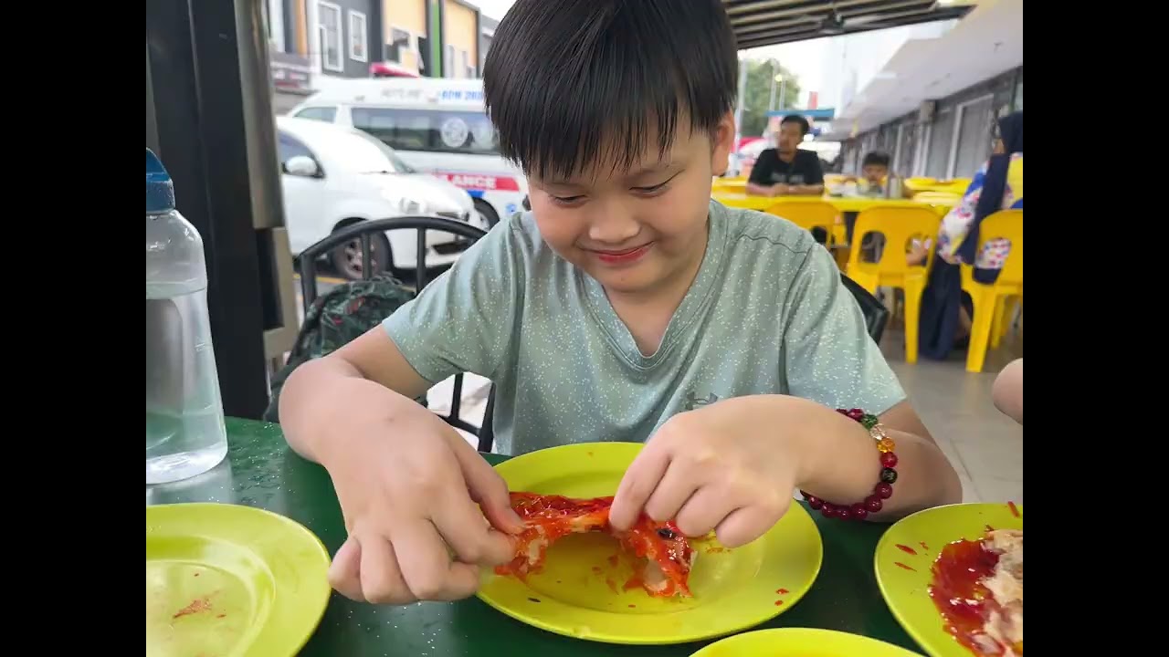 Spending time eating Roti Canai with kids 