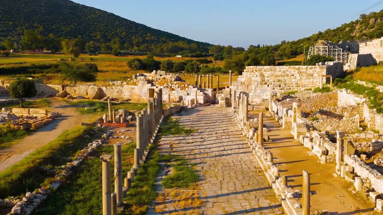 Dolly zoom. Gelemis, Turkey. Aerial flight over Colonnaded Street in Patara ancient city, low per...