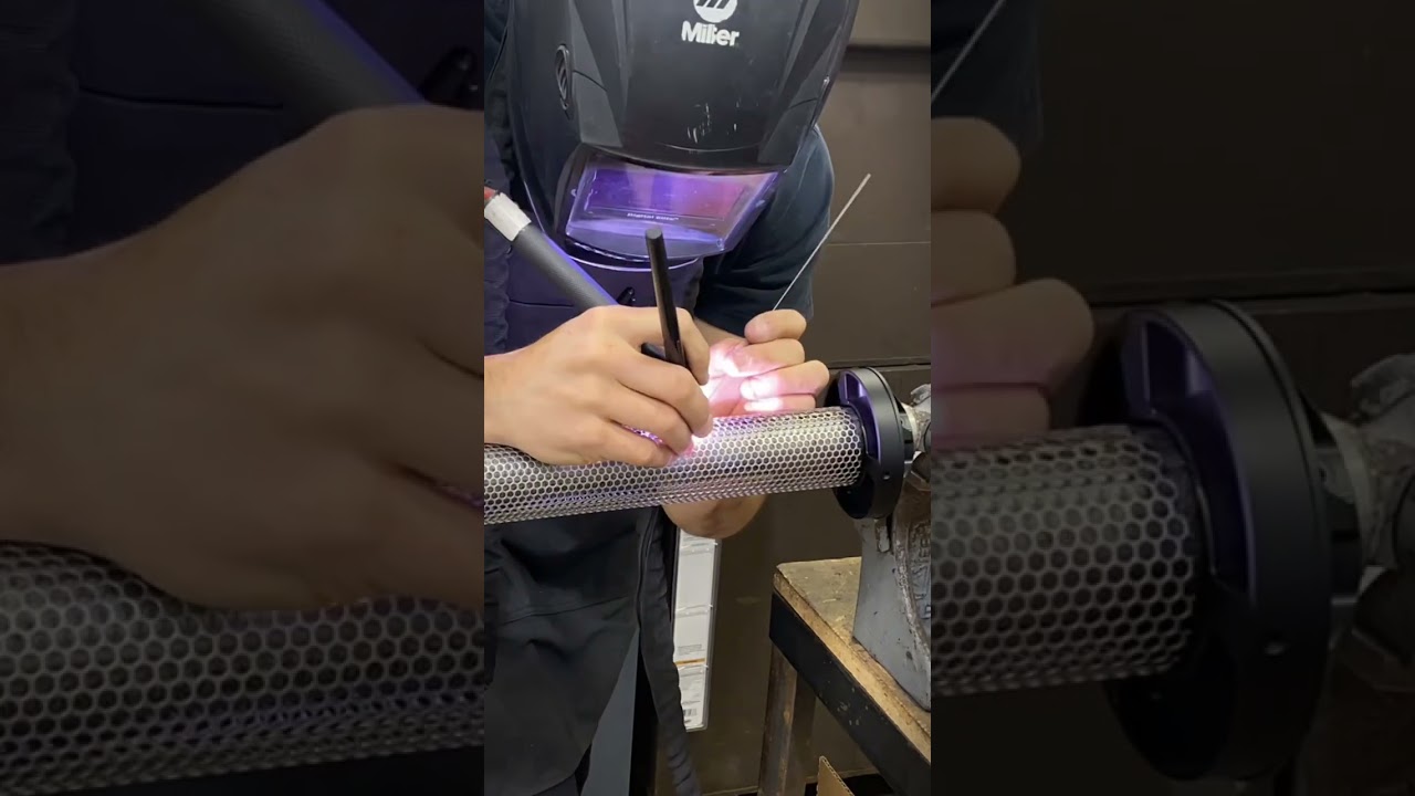 Fabricating perforated muffler cores for motorcycle racing exhausts . 🏁