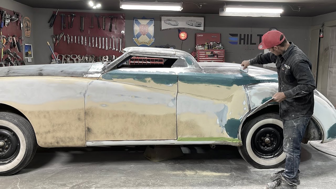 BODY WORK: applying fibreglass reinforced filler over all welds | 1959 Jaguar