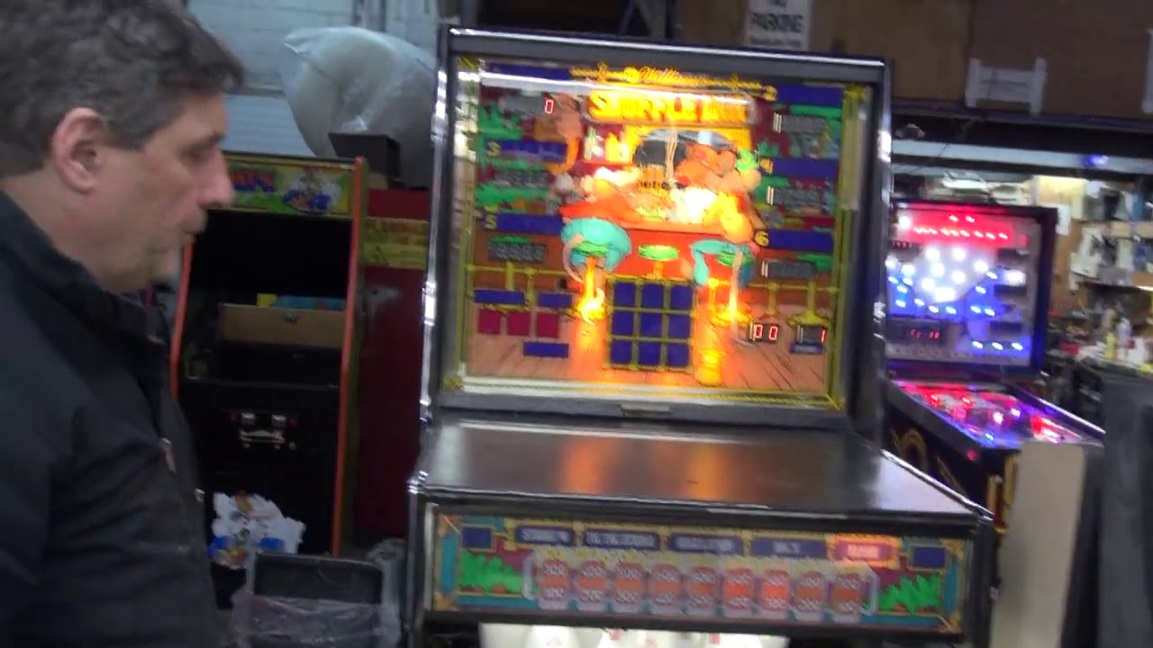 Todd and Curt clown around with a Williams SHUFFLE INN Shuffle Alley- TNT Amusements
