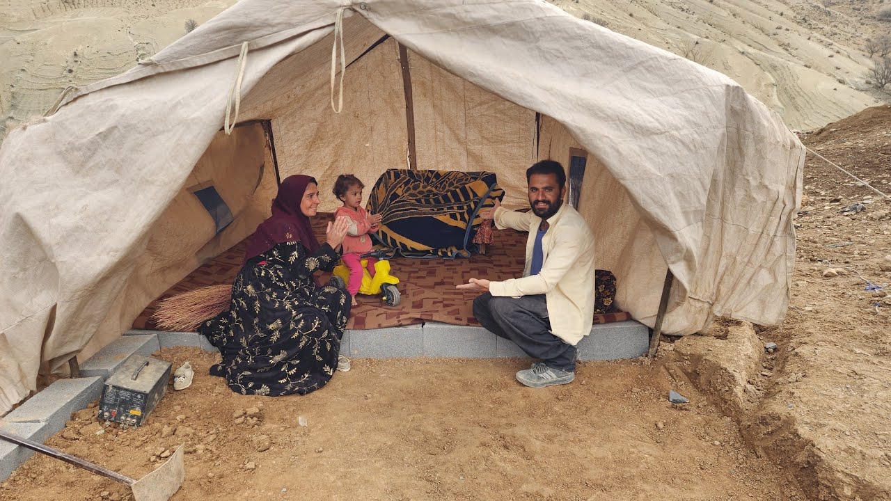Ramin and Narges setting up the tent