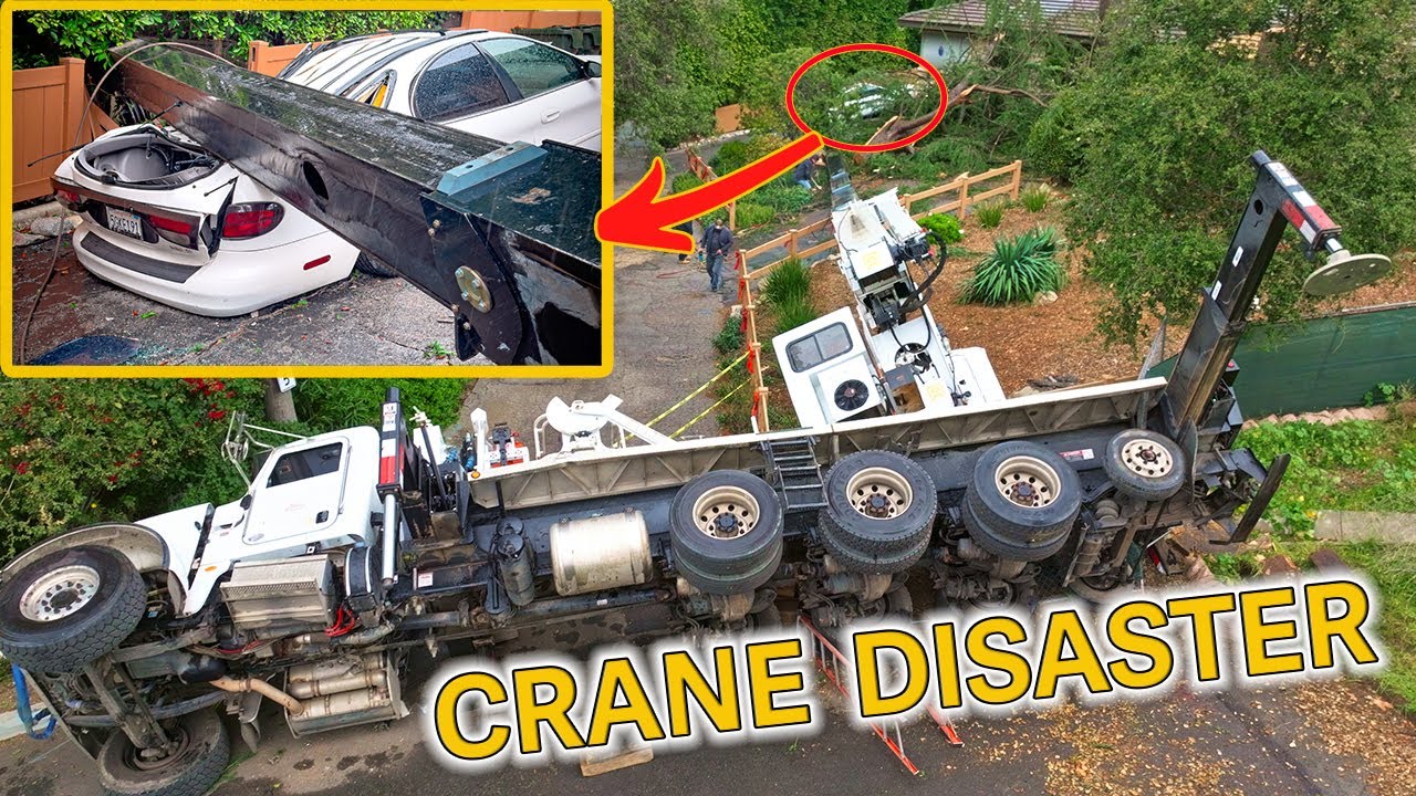 Crane falls over house - crushes car in driveway