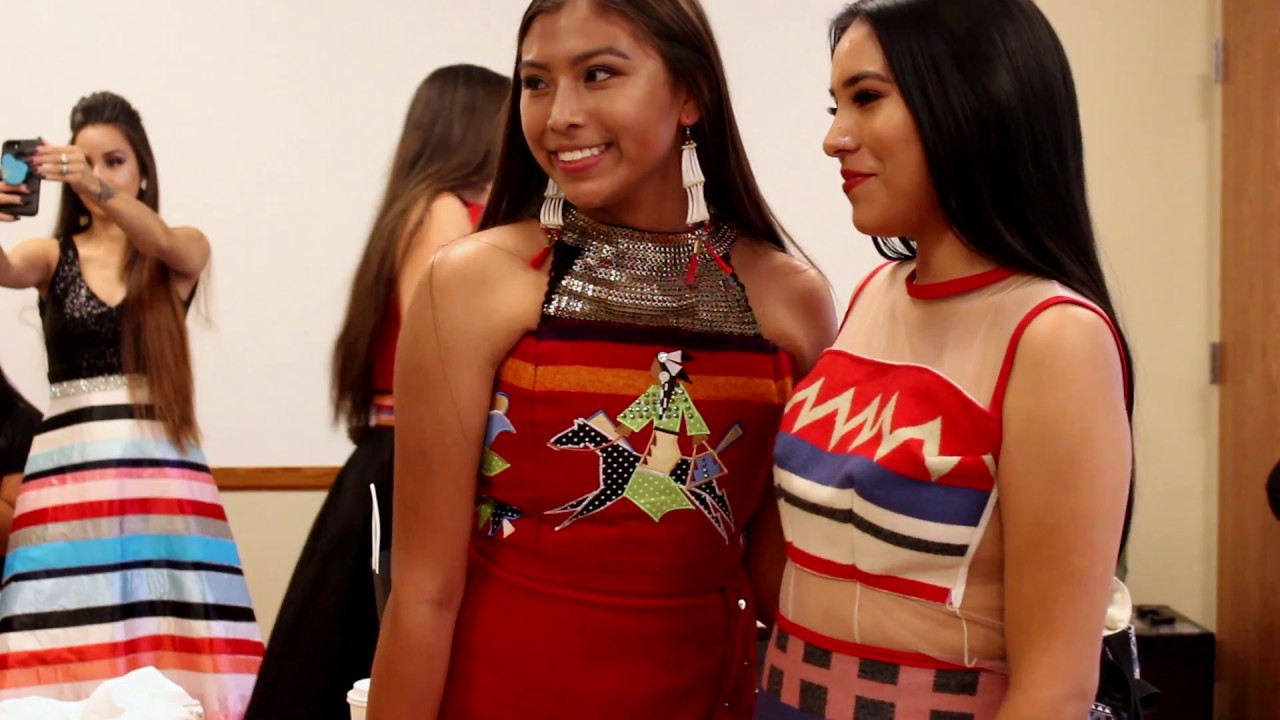 A RED BERRY WOMAN NATIVE FASHION SHOW