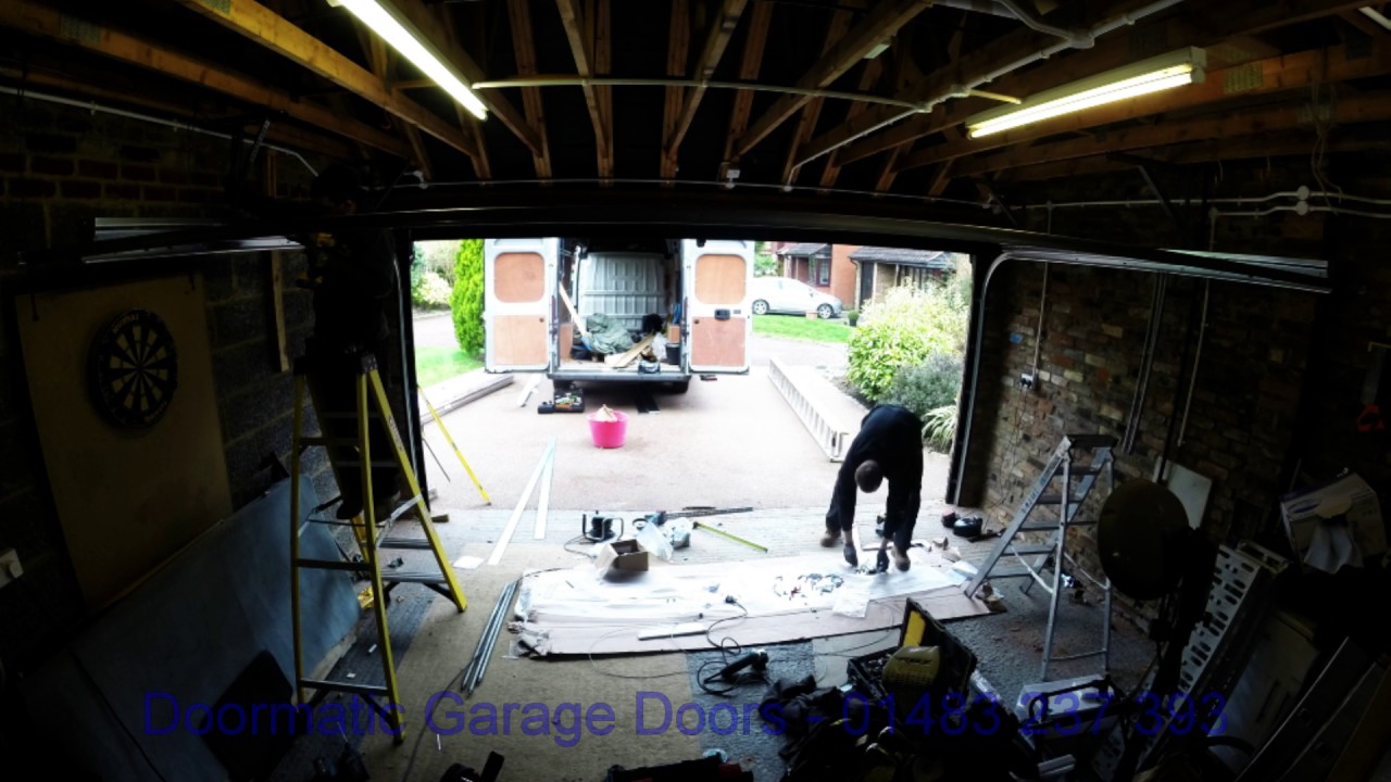 Installing a Carteck Black Woodgrain Sectional Garage Door