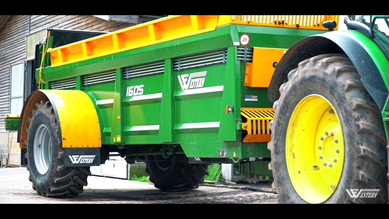 Manure spreader WF16DS Western. Manure spreading on field.