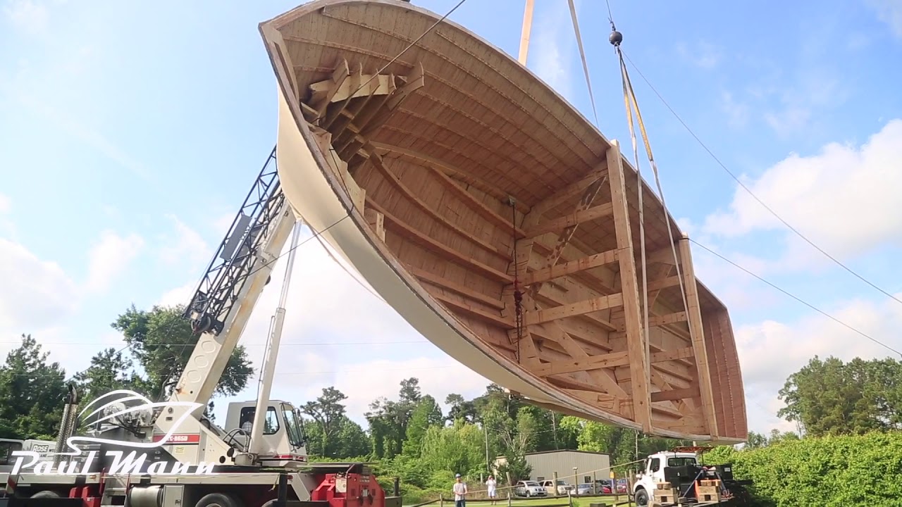 Paul Mann Custom Boats Team Celebrating Hull “Flip” And Construction Progress on 63-foot Hull 140