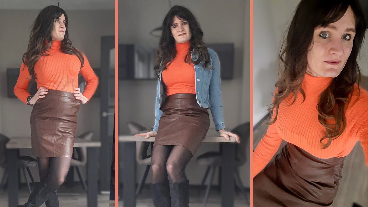 Sexy crossdresser wearing leather skirt and tights.