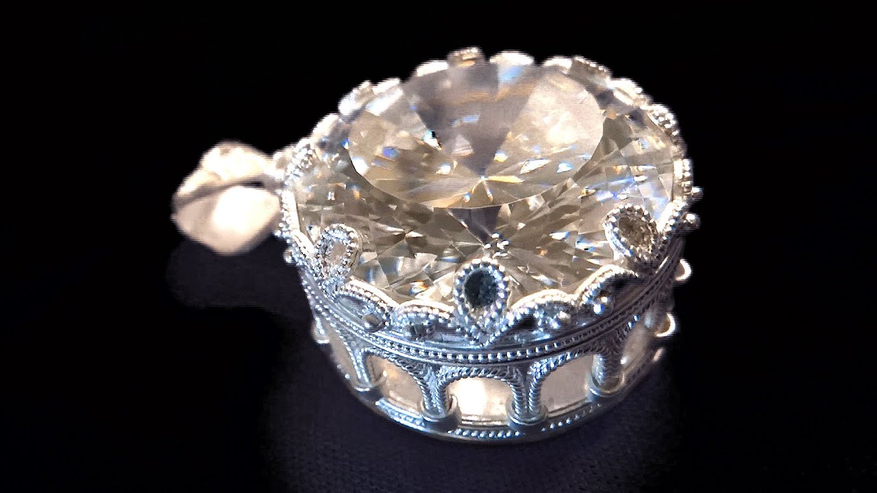 Jewellery making medieval arcades setting of a gem.