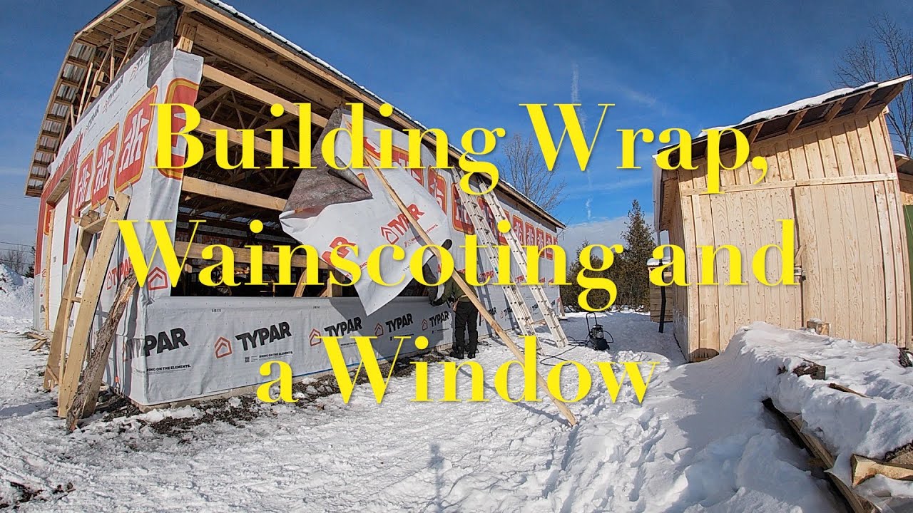 Building a Pole Barn: Building Wrap, Wainscoting and a Window