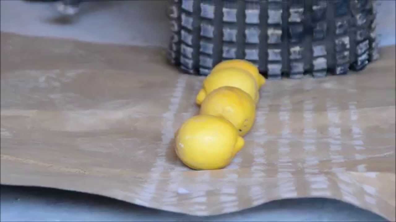 lemons run over and crushed flat under rear tire