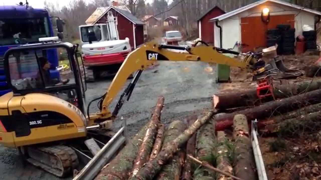 Collecting firewood with CAT 302.5C and homemade tracked vehicle