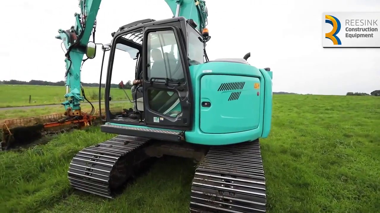 maaikorven   Kobelco sk 140 sr  ,  maaikorfen herder