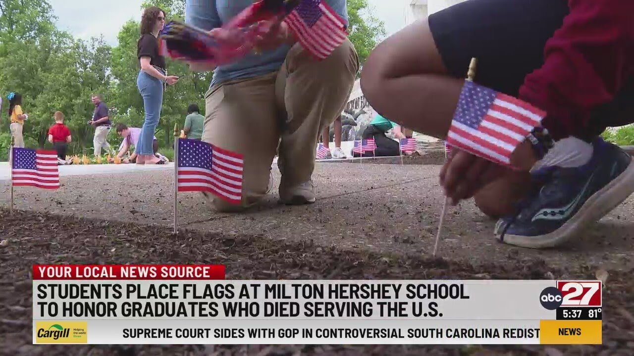 Students place flags at Milton Hershey School to honor graduates who died serving the U.S.