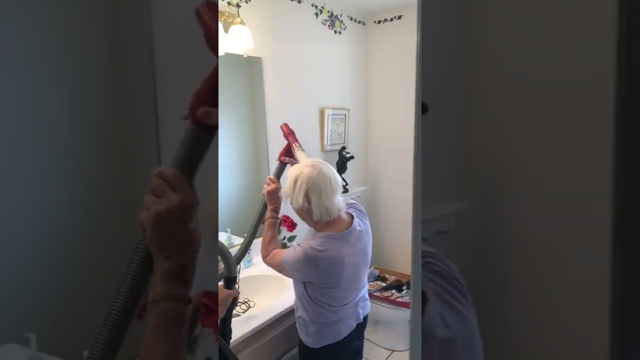 Grandma is having a very good day with her Flowbee hair cutting tool.