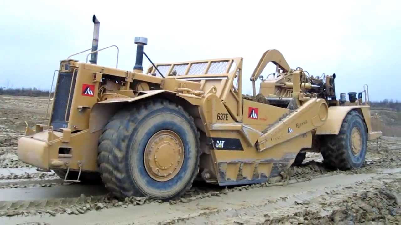 Caterpillar 637E and 637G motor scrapers in action - part 1