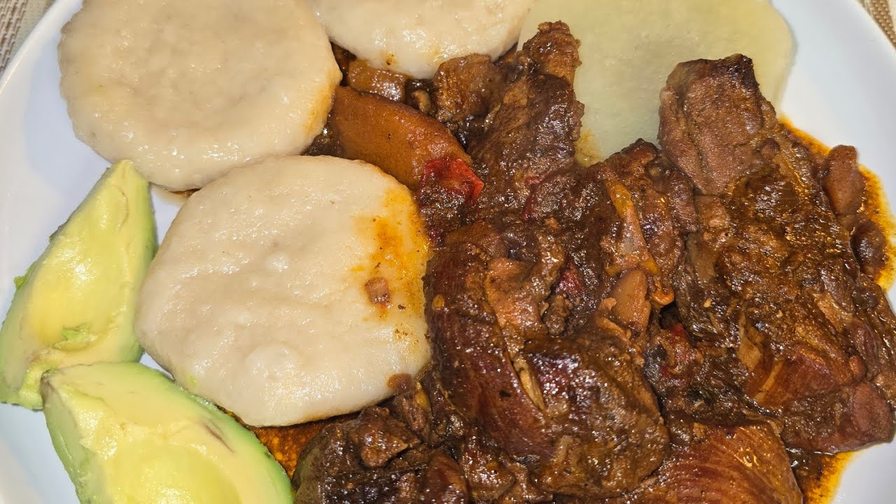 Brown strew chicken with boiled dumplin and white yam avocado 