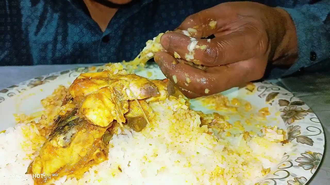 Eating rice and spice fish curry 