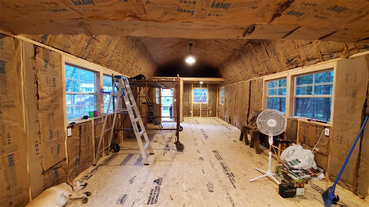 Taking down beams and adding insulation in the she shed