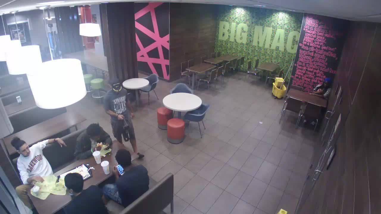 Surveillance video shows man stealing bag with iPad inside at McDonald's