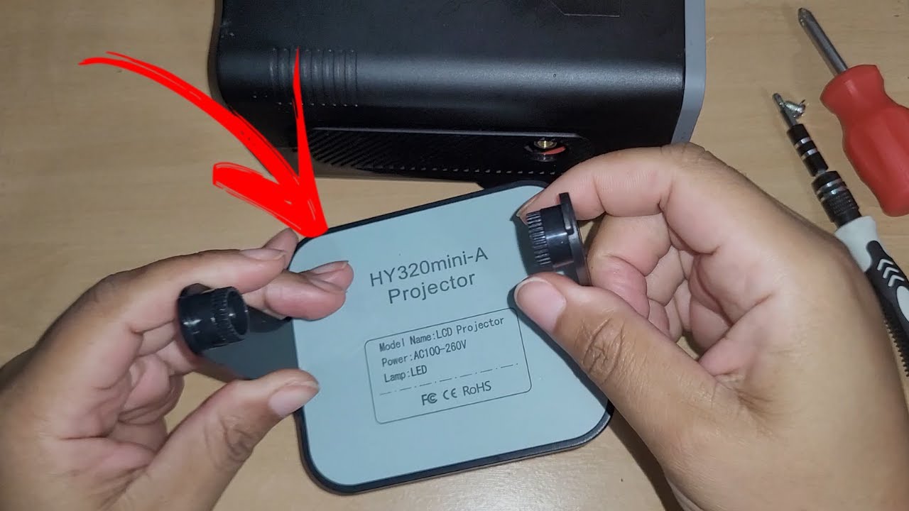 como tirar a base do projetor hy320
