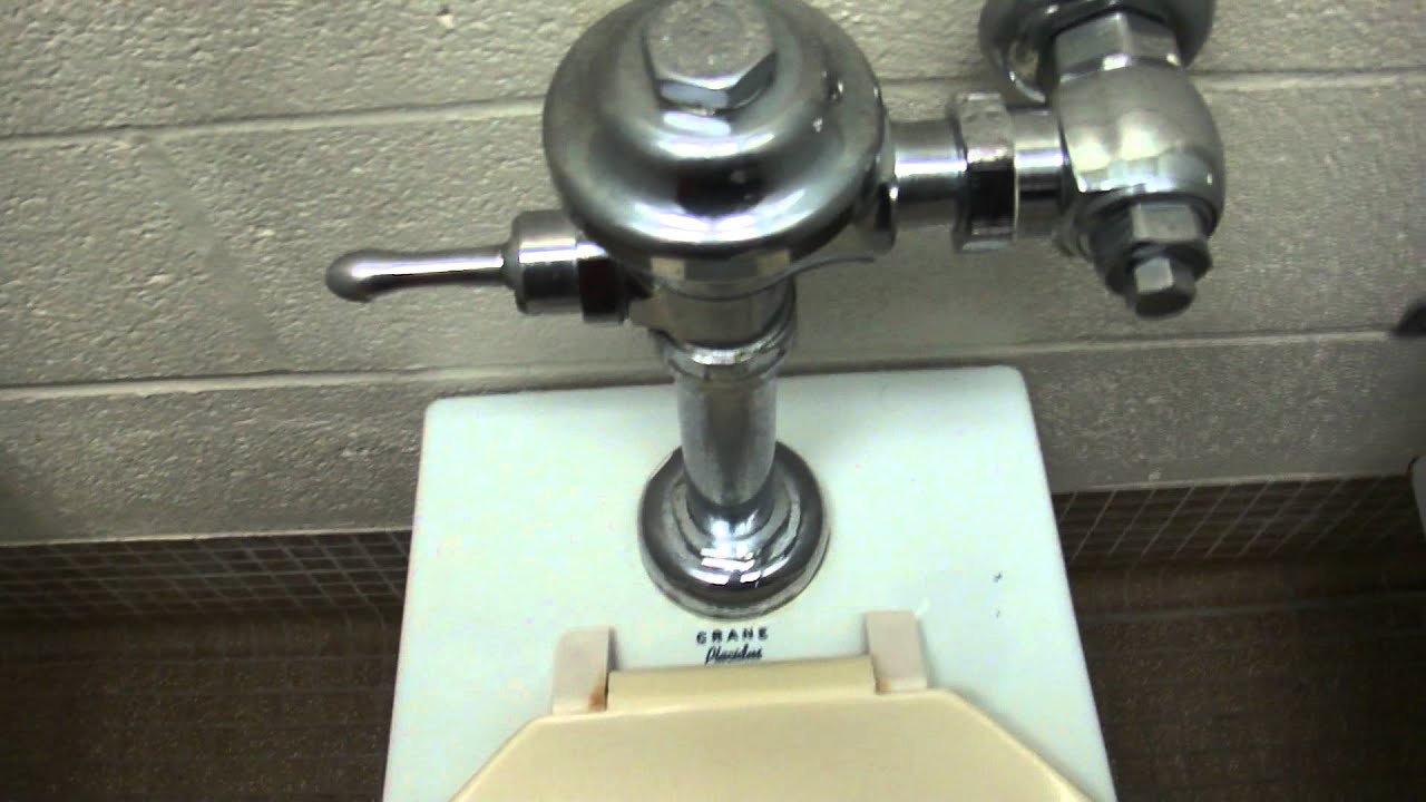 081: An early 70's bathroom featuring Crane Del Rio urinals and Crane Placidus toilets.