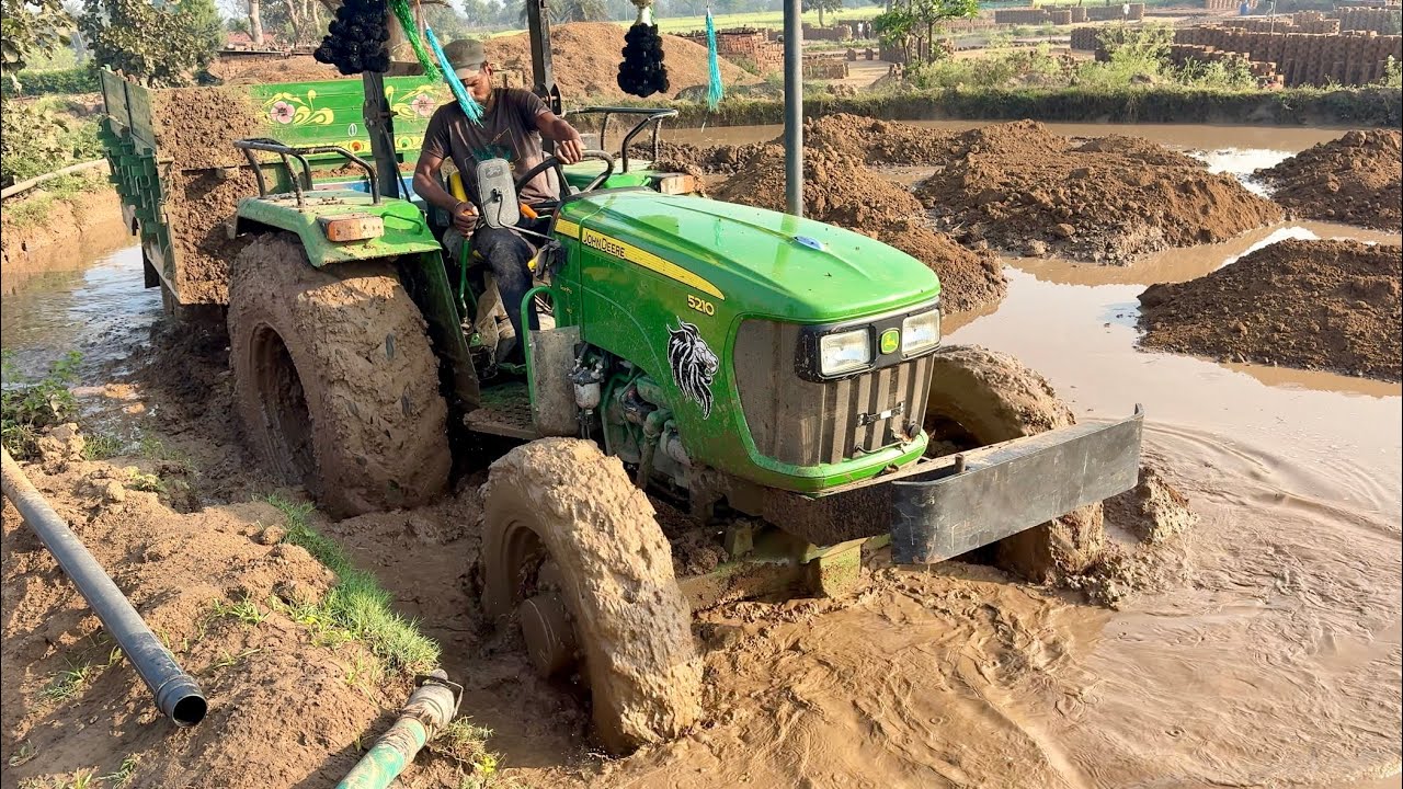 John Deere 5210 4wd Tractor got stuck in mud, how will it get out now?