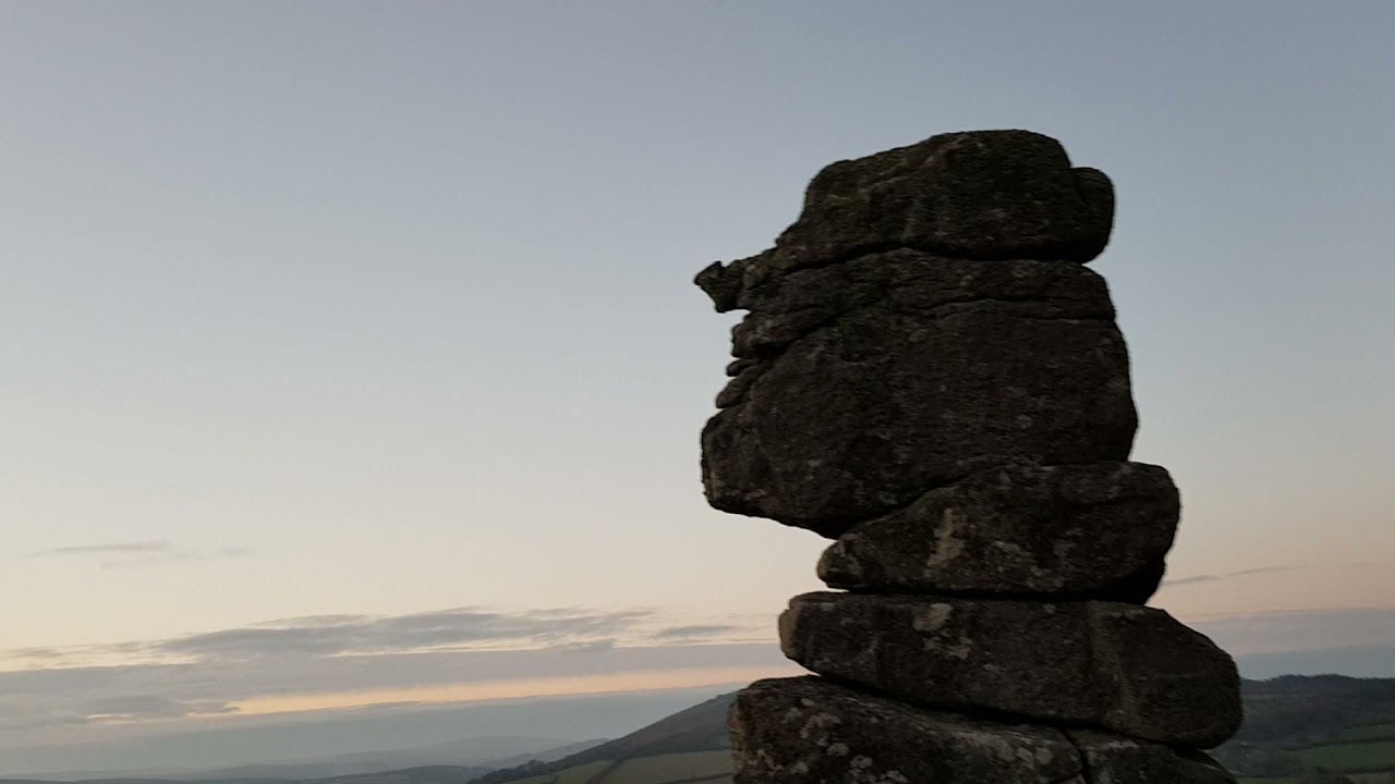sun is setting at Bowermans nose. Dartmoor July 2022