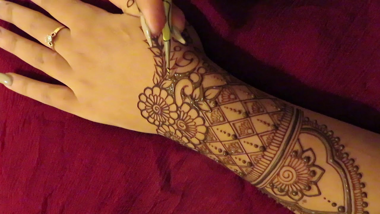 Intricate Mid-Arm to Hand Henna Design