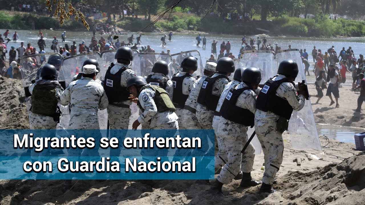 A pedradas y gas chocan Guardia Nacional y caravana migrante