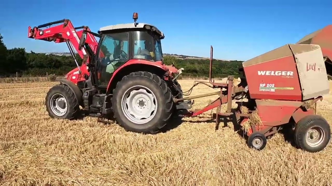 Round baling straw.