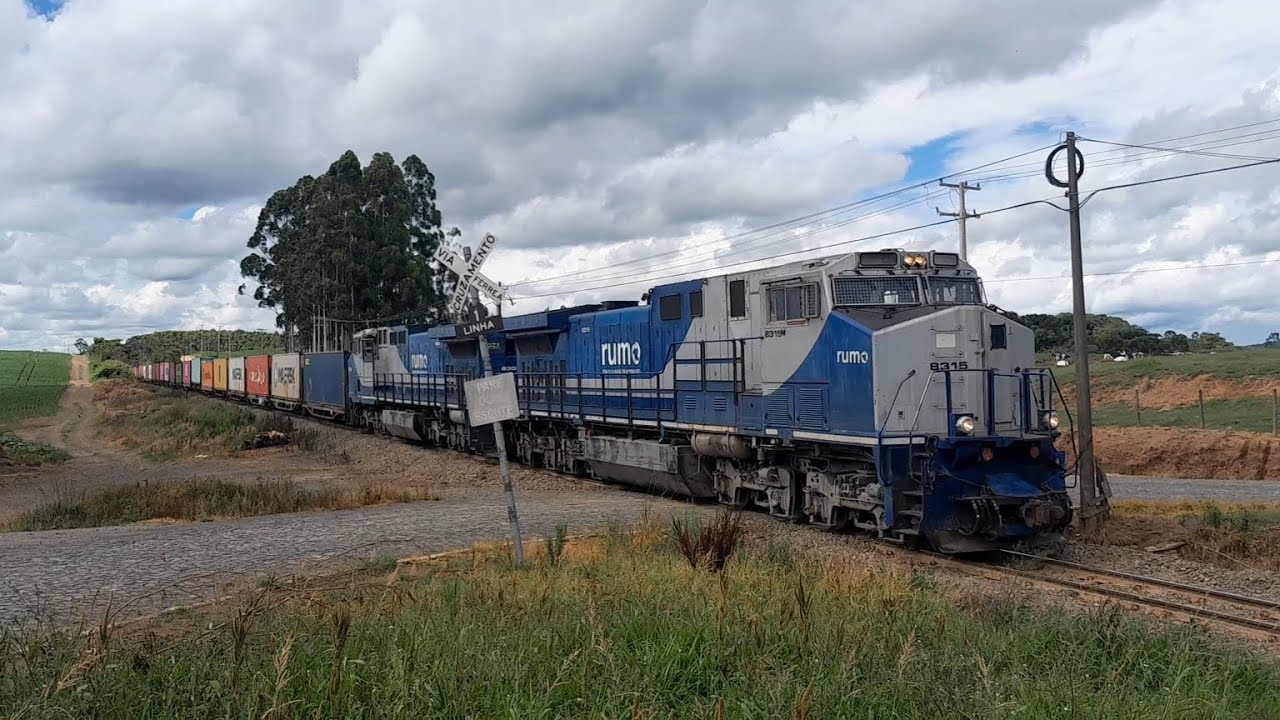 TREM RUMO com Dupla de Dash-9, no trem de containers carregados 