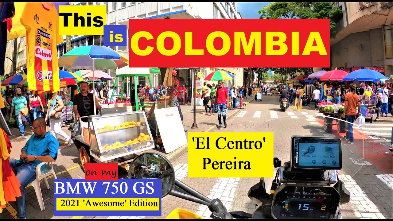 El Centro - Pereira, Colombia. People, traffic, sun & rain.