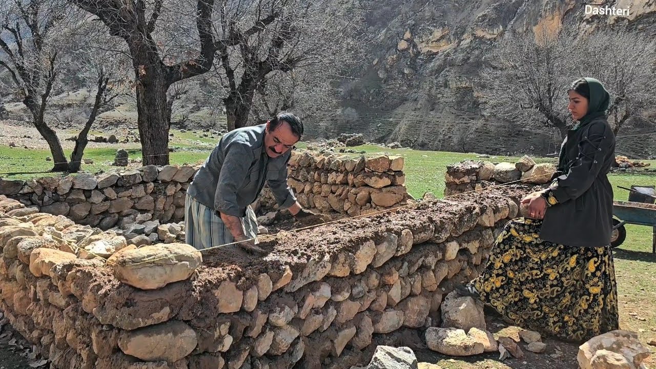 Leila and Hassan are happily working on the roof of the mountain hut.