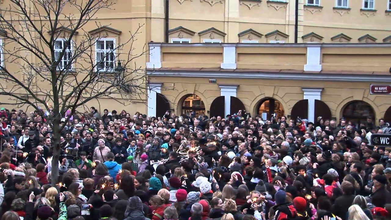 Traditional Czech carol sung by a crowd beneath the Charles bridge in Prague