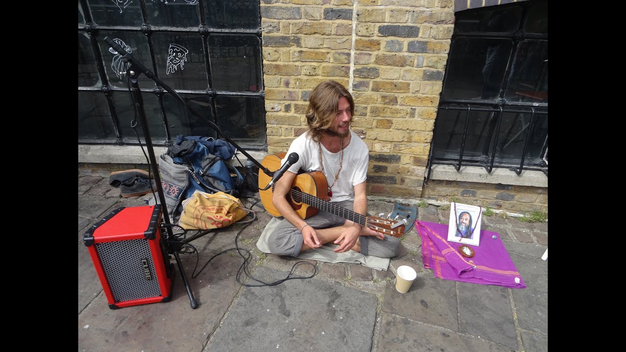 A brief encounter with singer songwriter Sam Garrett + he sings some of his songs in Camden Market.
