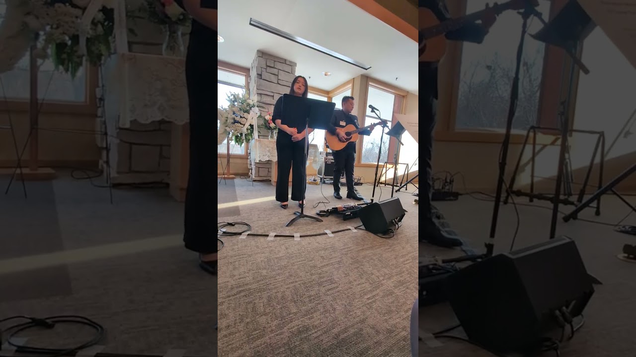 Chee and Jocelyn singing Come to the Alter.  
