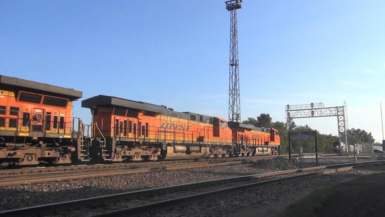 BNSF grainer meets the AMTK Empire Builder in Minot, ND