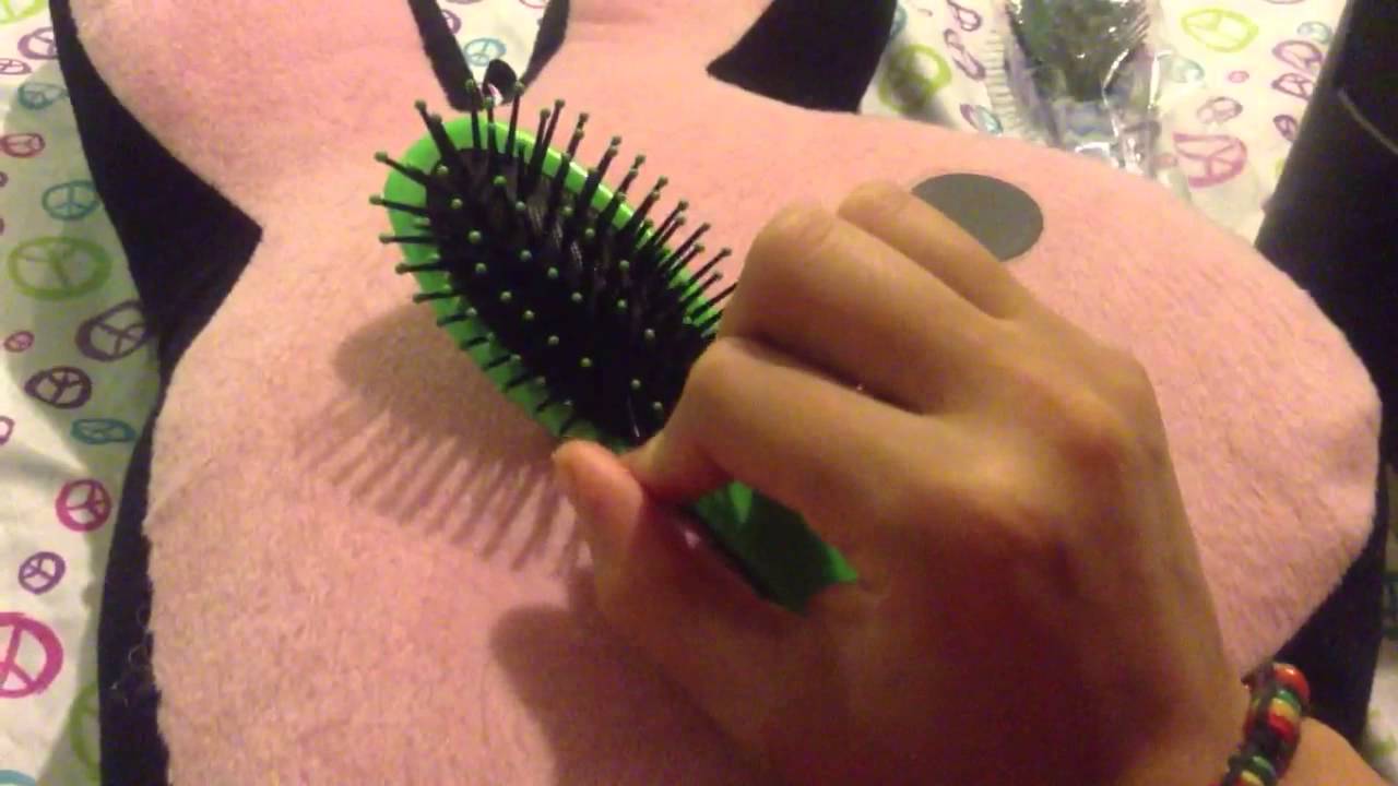My first ASMR video: whispering, hair brushing, and plastic