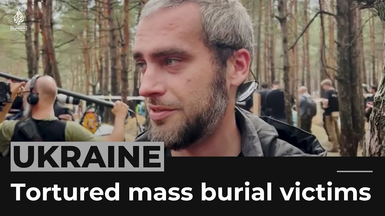 Ukrainian president says some mass burial victims were tortured