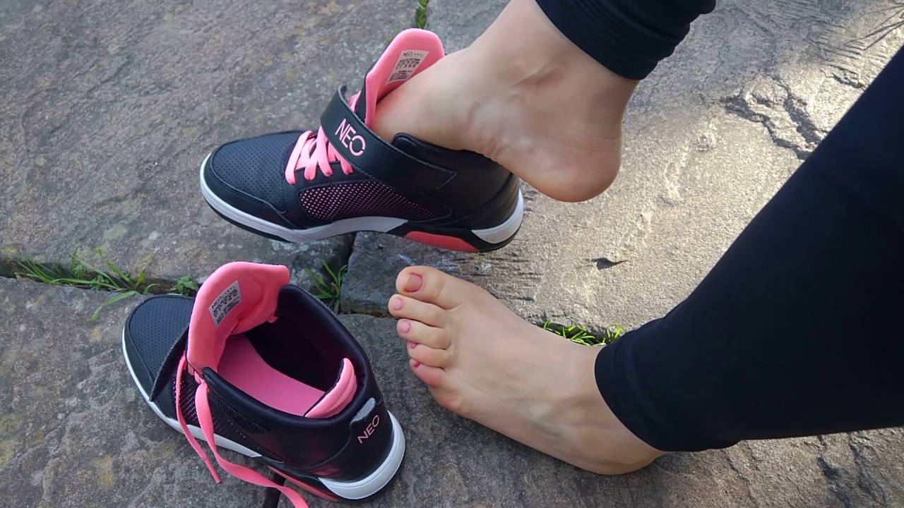 She is sockless all day in her Adidas Neo hi tops