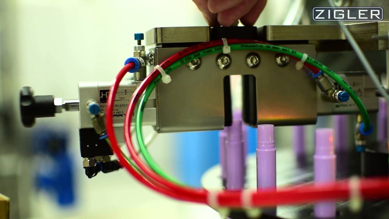 Automatic machine for filling and closing of vials and cosmetic pens
