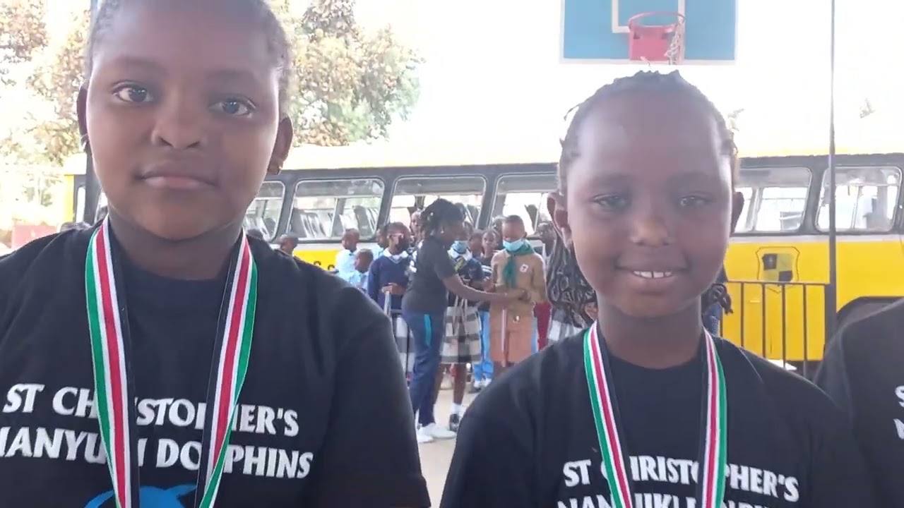 Awarding the Saint's Dolphins who went to Mombasa Swimming Gala
